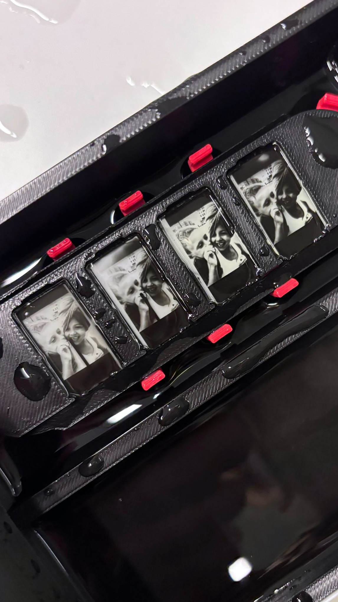 The SIM Project — SIM card-sized silver emulsion photographic pendants